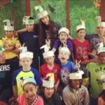 Shylah (top row, third from left) with students at a former in-person teaching job.