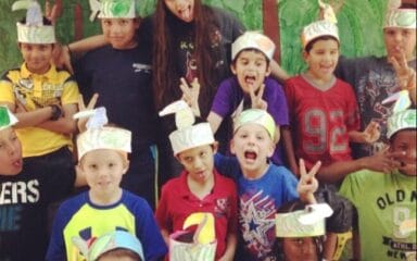 Shylah (top row, third from left) with students at a former in-person teaching job.