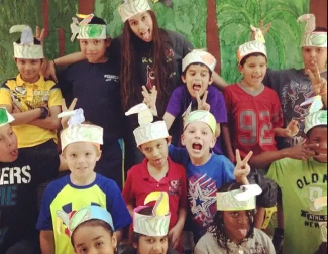 Shylah (top row, third from left) with students at a former in-person teaching job.
