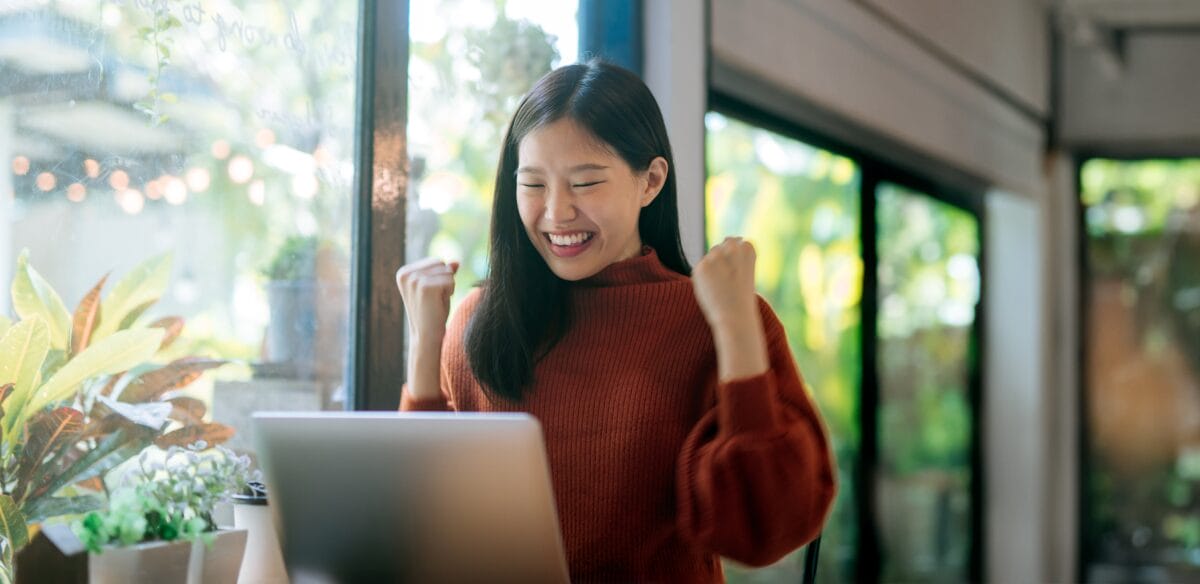 High school student smiling to her online class