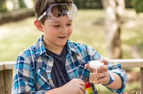 Elementary student wearing goggles