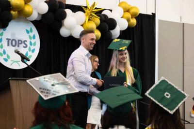 student receiving diploma