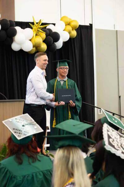 boy receiving diploma