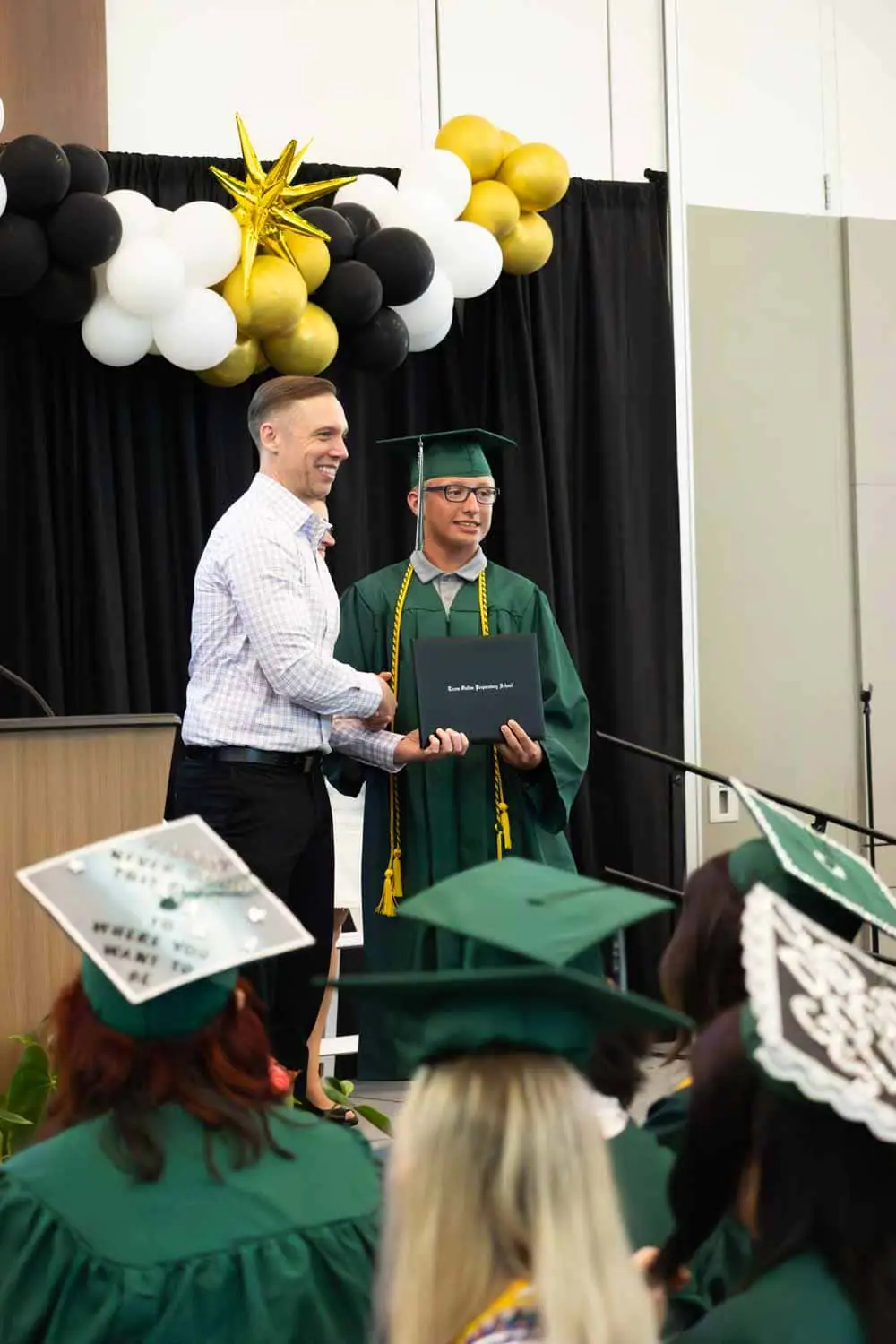 boy receiving diploma