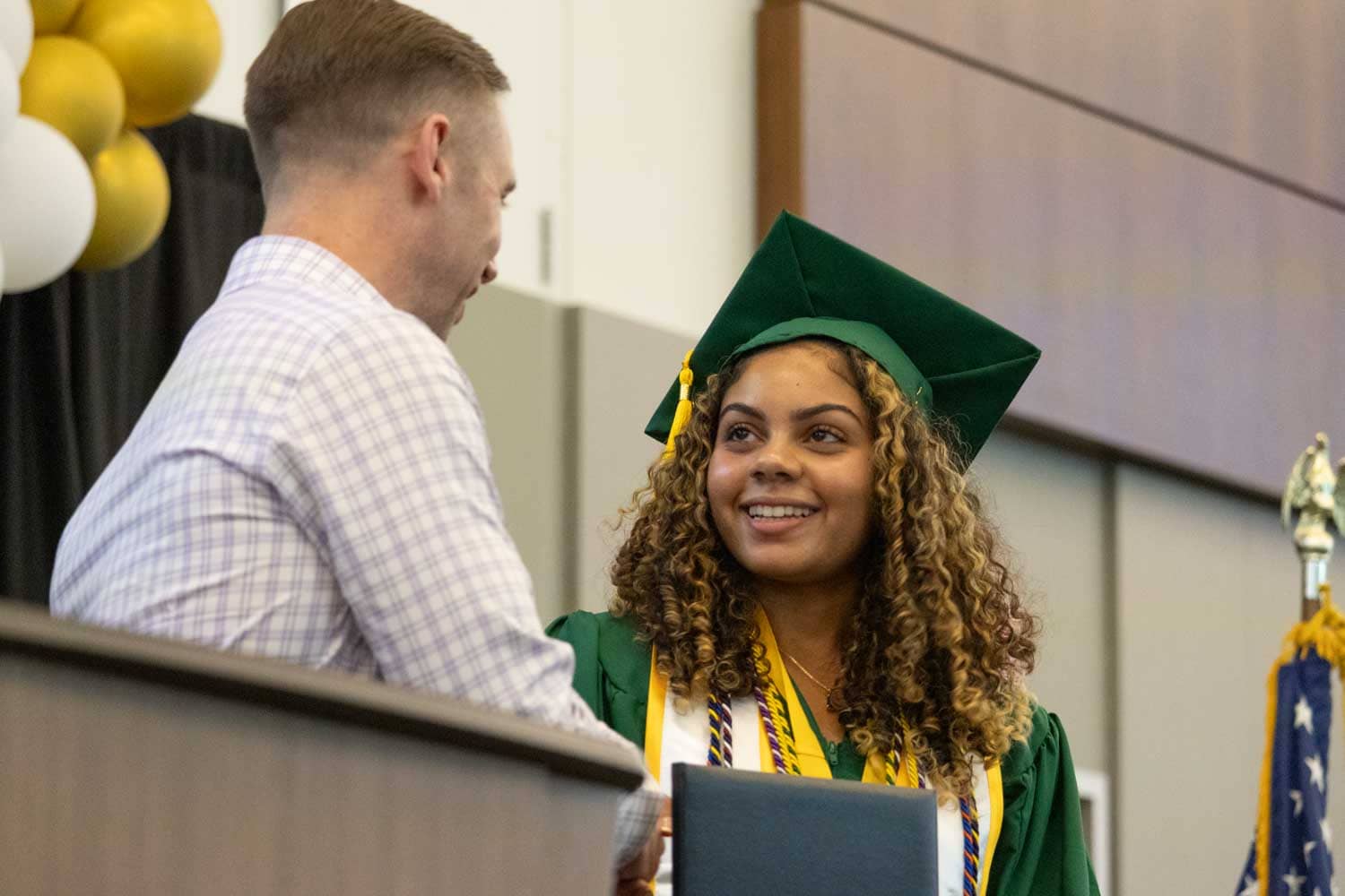 girl receiving a diploma