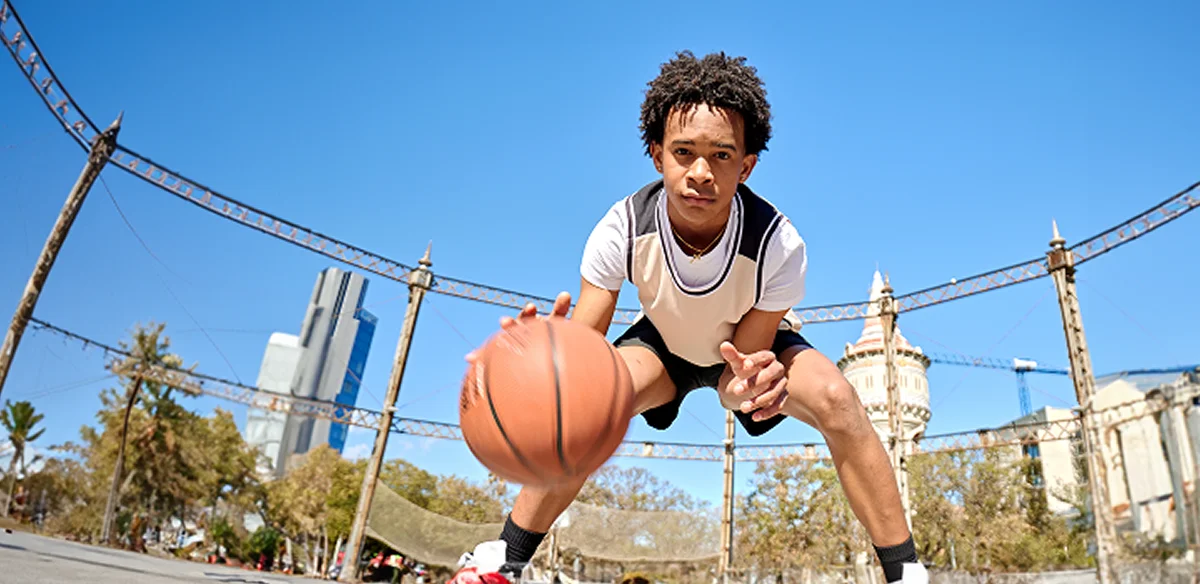 Student playing basketball